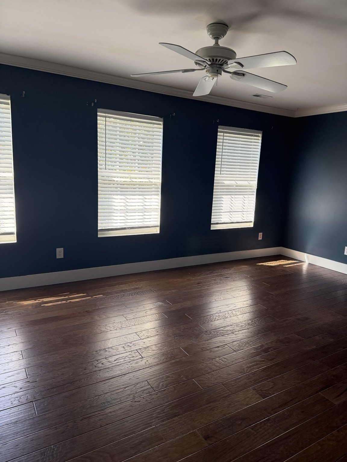 Clean Queen NC cleaning work - bright bedroom with hardwood floors